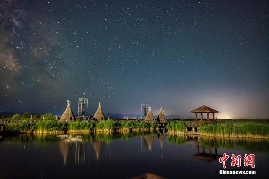 Starry night sky with Milky Way over Nalati grassland in Xinjiang