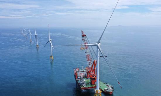 Chinese firm completes world's first equipment that combines wind turbine and fish farm