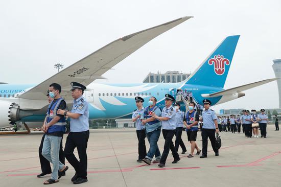 164 fraud suspects brought back to China from Laos