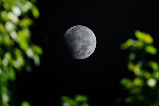 Last lunar eclipse of 2023 spotted across China