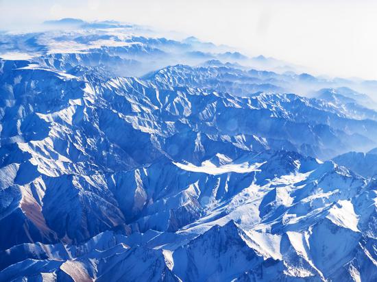 View of snow-capped Tianshan Mountain Range from flight