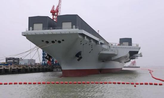 The Fujian, the third aircraft carrier of China, undergoes outfitting and mooring trials in Shanghai in early 2023. (Photo/Screenshot from China Central Television)