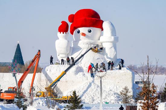 Landmark snowman under construction in NE China