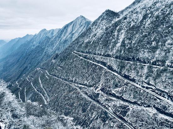 Breathtaking scenery of zig-zag road in snow