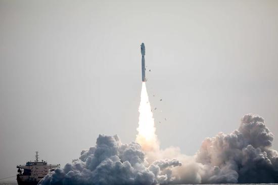 China launched a Smart Dragon 3 carrier rocket on Saturday morning off the coast of Yangjiang in Guangdong province, placing nine satellites in space. (Photo by Chen Xiaolong for China Daily)