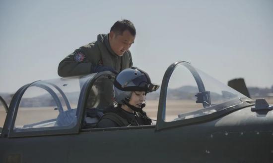 PLA Navy's first female carrier-based aircraft pilots successfully complete solo flight training
