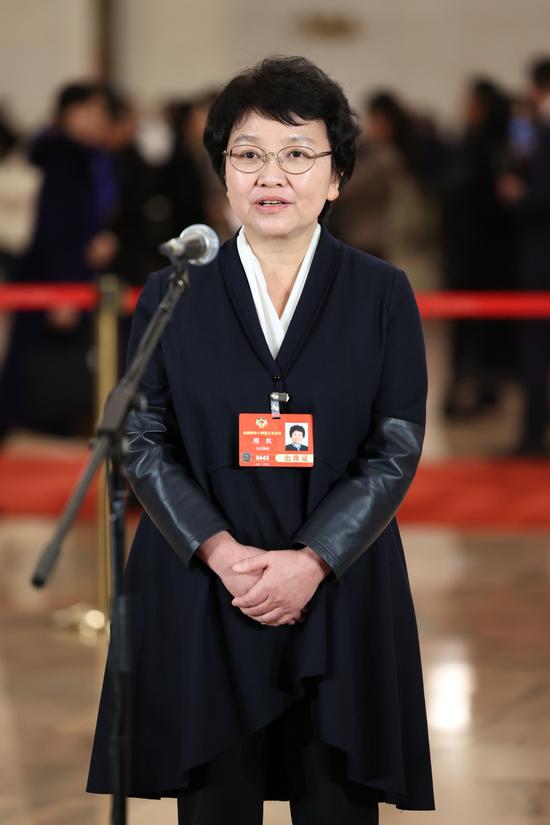 Zhou Lan, a member of the 14th National Committee of the Chinese People's Political Consultative Conference, attends a group interview ahead of the opening meeting of the third session of the 14th CPPCC National Committee at the Great Hall of the People in Beijing, on March 4, 2025. (Photo by Wang Jing/chinadaily.com.cn)