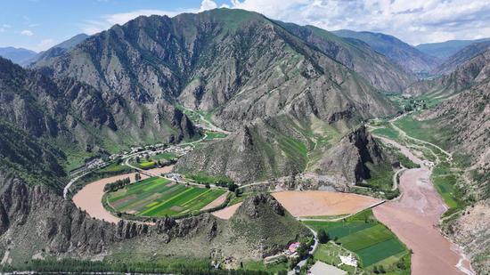 Aerial view of village at southern foothills of the Qilian Mountains
