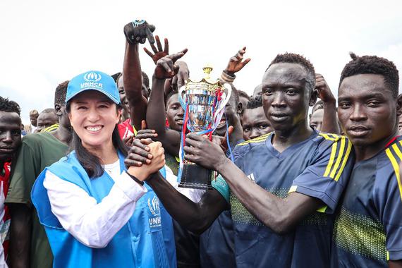 UNHCR Goodwill Ambassador Yang Yang lifts the trophy with the winning team after a friendly football match between refugees and the host community at the Bambasi Refugee Camp in Ethiopia, September 23, 2025. (Photo: UNHCR)