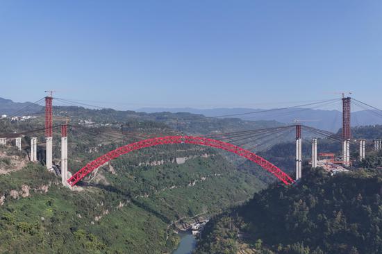 China completes world's largest-span steel arch bridge