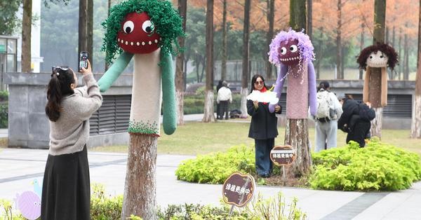 Cartoon outfits add warmth, whimsy to trees in Chongqing