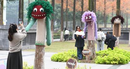 Cartoon outfits add warmth, whimsy to trees in Chongqing