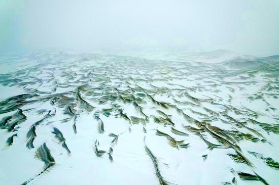 Kum Tag Desert welcomes its first snowfall this winter