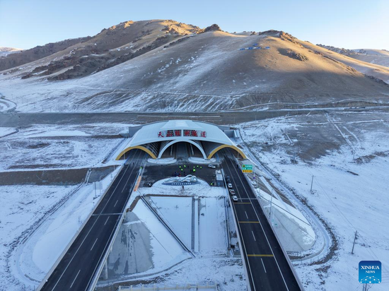An aerial drone photo shows an exterior view of Tianshan Shengli Tunnel on Urumqi-Yuli Expressway in northwest China's Xinjiang Uygur Autonomous Region, Dec. 26, 2025. (Xinhua/Hu Huhu)