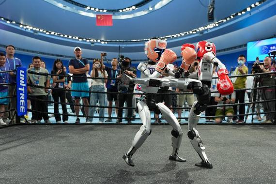This file photo taken on Aug. 15, 2025 shows humanoid robots combating during a kickboxing match at the 2025 World Humanoid Robot Games in Beijing, capital of China. (Xinhua/Ju Huanzong)