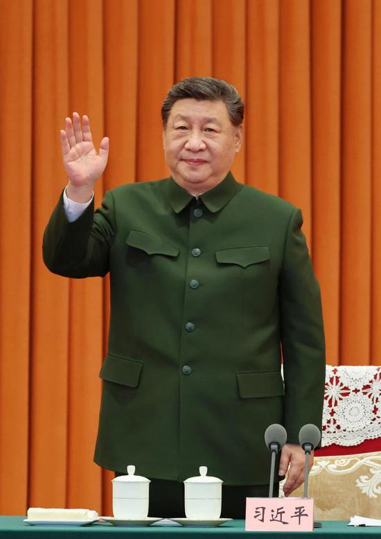 Chinese President Xi Jinping, also general secretary of the Communist Party of China (CPC) Central Committee and chairman of the Central Military Commission (CMC), waves to service personnel via video link in Beijing, capital of China, Feb. 10, 2026. Xi on Tuesday reviewed the armed forces' combat readiness and ongoing operations and extended Spring Festival greetings to all service members of the country via video link in Beijing.  (Xinhua/Li Gang