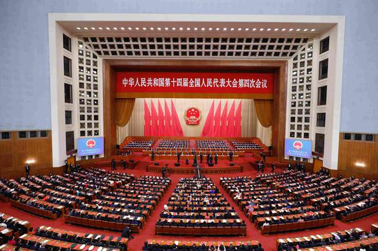China's national legislature holds closing meeting of annual session