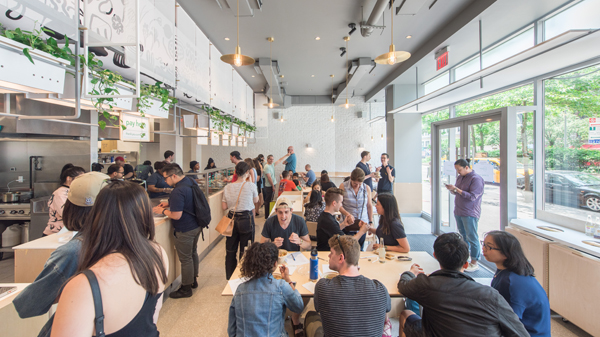 Diners fill a Junzi Kitchen restaurant as the fast-growing chain gains popularity in the United States. (Photo provided to China Daily)