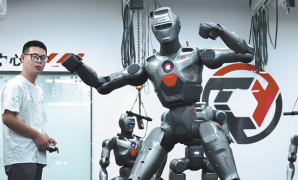 A robot developed by Chinese tech company EngineAI dances in Shenzhen, Guangdong province, on June 25, 2025. LI AN/XINHUA