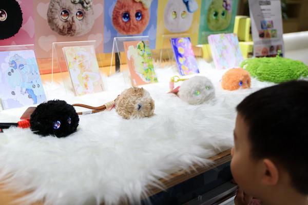 At a bustling store in south China's metropolis of Shenzhen, a small crowd gathers around what looks, at first glance, like an ordinary display of plush toys. They are soft, round and brightly colored, the sort of companions that have filled children's rooms for decades. But then they begin to murmur in their own uniquely programmed digital dialect.