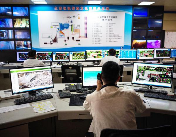 Staff members work at the central control room of a waste-to-energy plant at a circular economy industrial park in Binhai New Area of Tianjin, north China, April 23, 2026.  (Photo by Lan Hongguang/Xinhua)