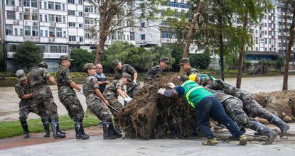 Soldiers clear roads and debris as floodwaters recede in Guangxi