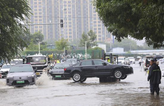 Typhoon Dolphin brings heavy rain to Beijing