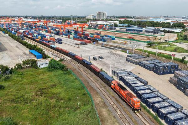 An aerial drone photo taken on Aug. 27, 2025 shows a freight train arriving at the multi-modal transport center of the China-SCO Local Economic and Trade Cooperation Demonstration Area in Qingdao, east China's Shandong Province. (Xinhua/Li Ziheng)