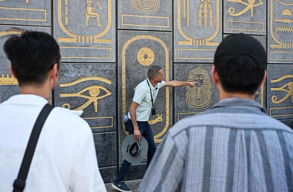 Egyptian tour guide Abbas Sayed gives a guided tour to visitors at the Grand Egyptian Museum in Giza, Egypt, July 2, 2026. (Xinhua/Xin Mengchen)