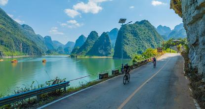 Cyclists race through Guangxi's karst landscape