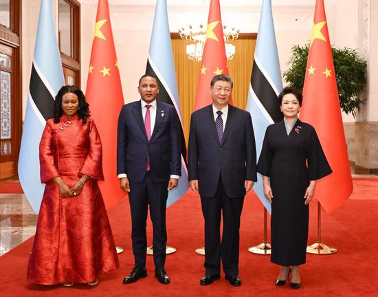 Chinese President Xi Jinping and his wife Peng Liyuan hold a welcome ceremony for Botswana's President Duma Gideon Boko and his wife Kaone Boko in the Northern Hall of the Great Hall of the People in Beijing, capital of China, Oct. 13, 2026. Xi held talks with Boko, who is on a state visit to China, after the welcome ceremony in Beijing on Tuesday. (Xinhua/Xie Huanchi)