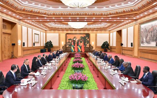 Chinese President Xi Jinping meets with President of the Council of Ministers of Togo Faure Essozimna Gnassingbé, who is on an official visit to China, at the Great Hall of the People in Beijing, capital of China, Oct. 13, 2026. (Xinhua/Yue Yuewei)