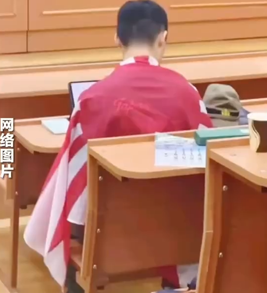 An image circulating online shows a Chinese student at Moscow State University wearing an item featuring Japan’s Rising Sun flag during class.