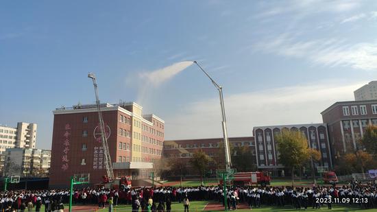 新疆师范大学附属中学消防疏散演练119消防宣传月活动拉开序幕